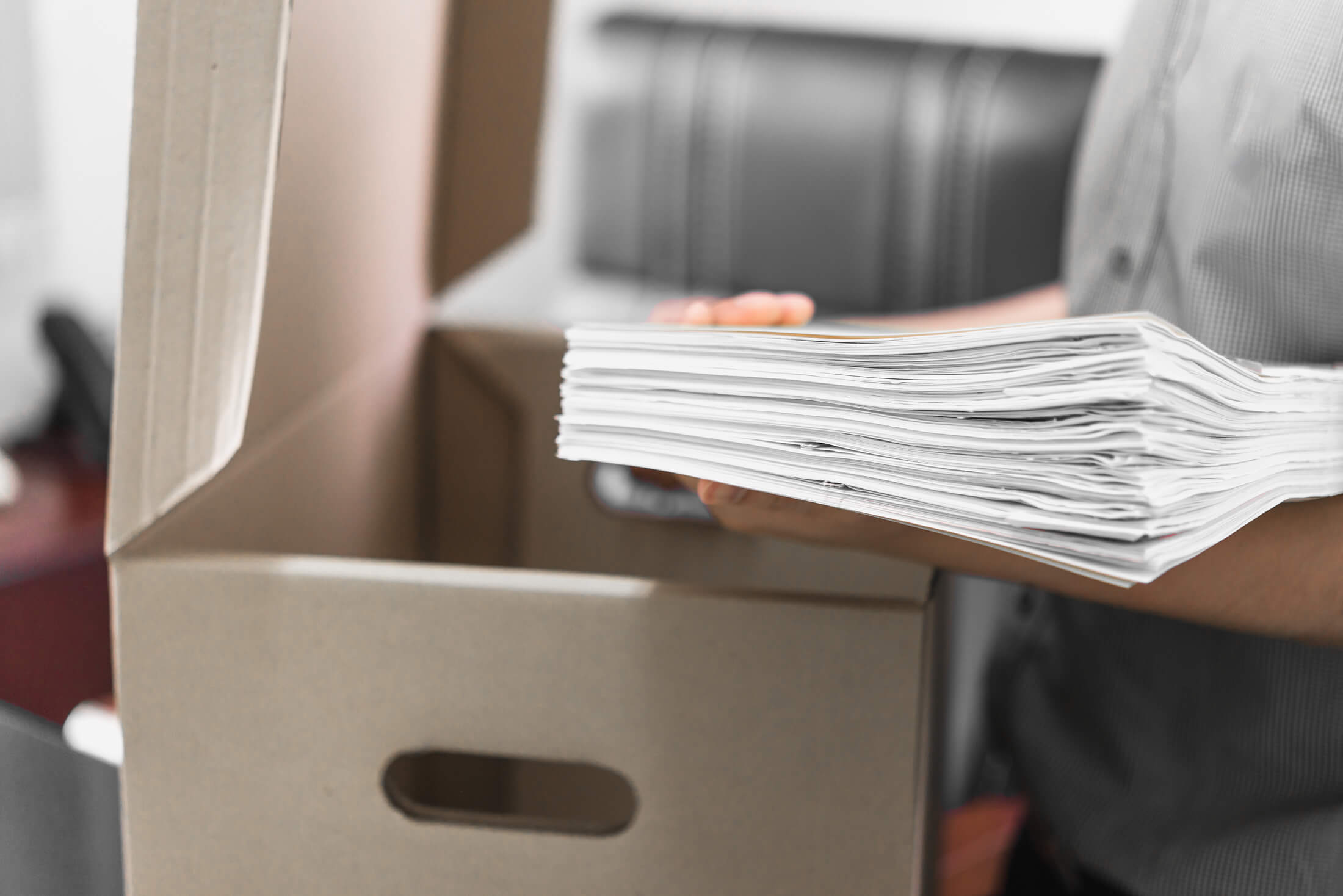 upset-employee-packing-belongings-box